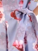 Elegancka sukienka rozkloszowana midi w kwiaty – kobiecy krój z ozdobną kokardą 33341