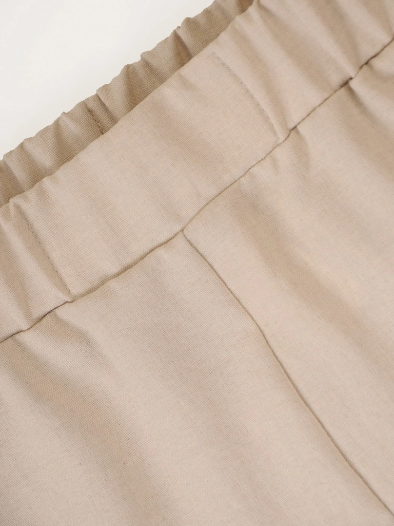 Beżowe spodnie wide leg z wysokim stanem – optycznie wydłużające nogi, na letnie dni 39532