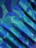 Elegancka sukienka trapezowa midi w zielono-granatowy print – fason tuszujący biodra z mankietami 38365