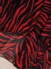 Elegancka czerwona sukienka wizytowa w zwierzęcy deseń – asymetryczny krój syrenka z kobiecymi falbanami 26782