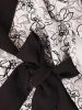 Elegancki kostium damski ze spodniami w kwiaty – wysmuklający fason z dekoltem w serek 39884