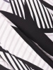 Elegancka sukienka rozkloszowana midi w kontrastowy wzór – wysmuklający talię krój z kontrafałdami 40061